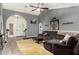 Stylish living room with neutral paint, wood-look floors, and comfortable seating at 10211 W Hazelwood Ave, Phoenix, AZ 85037