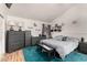 A main bedroom with a grey dresser, safe, ceiling fan, decor, and an accent rug at 10211 W Hazelwood Ave, Phoenix, AZ 85037