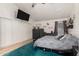 A main bedroom with a TV, safe, ceiling fan, and closet with white double doors at 10211 W Hazelwood Ave, Phoenix, AZ 85037