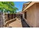 Cozy outdoor patio featuring brick pavers, privacy fence, and seating area at 10211 W Hazelwood Ave, Phoenix, AZ 85037