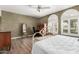 Spacious bedroom featuring arched windows and a decorative wrought iron bed frame at 1036 N Sierra Hermosa Dr, Litchfield Park, AZ 85340