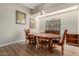 Elegant dining room featuring wood floors, chandelier lighting, and a wood dining set at 1036 N Sierra Hermosa Dr, Litchfield Park, AZ 85340