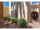 Front entryway featuring brick pavers and lush landscaping at 1036 N Sierra Hermosa Dr, Litchfield Park, AZ 85340