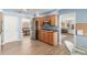 Spacious kitchen with stainless steel appliances, wood cabinets, and wood floors at 1036 N Sierra Hermosa Dr, Litchfield Park, AZ 85340