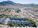 Real estate aerial view of blue colored homes and the surrounding neighborhood in desert landscape at 1102 W Peoria Ave # 17, Phoenix, AZ 85029