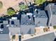 Real estate aerial view featuring a top-down view of roof, driveway and cars at 1102 W Peoria Ave # 17, Phoenix, AZ 85029