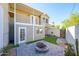 Beautiful backyard featuring a cozy fire pit area, artificial turf, and a private setting at 1102 W Peoria Ave # 17, Phoenix, AZ 85029