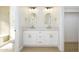 Bathroom featuring double vanity, white cabinetry, modern fixtures, and framed mirrors at 1102 W Peoria Ave # 17, Phoenix, AZ 85029