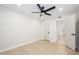 Well-lit bedroom showcases neutral walls and flooring, enhanced by a contemporary ceiling fan at 1102 W Peoria Ave # 17, Phoenix, AZ 85029