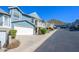 Street view of home featuring an attached garage and professional landscaping in a quiet neighborhood at 1102 W Peoria Ave # 17, Phoenix, AZ 85029