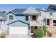 Charming two-story home with a white garage door and second-story balcony at 1102 W Peoria Ave # 17, Phoenix, AZ 85029