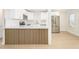 Bright kitchen with white cabinets, stainless steel appliances, and modern wood accent island at 1102 W Peoria Ave # 17, Phoenix, AZ 85029