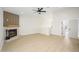 Bright living room features a fireplace, ceiling fan, and an open floor plan at 1102 W Peoria Ave # 17, Phoenix, AZ 85029