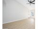 Bright living room featuring light-colored wood floors, white walls, ceiling fan, and natural light at 1102 W Peoria Ave # 17, Phoenix, AZ 85029