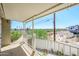 Covered patio with white railing overlooking a distant view of greenery and a recreational vehicle at 1102 W Peoria Ave # 17, Phoenix, AZ 85029