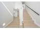 Bright home staircase features light wood steps and modern railing at 1102 W Peoria Ave # 17, Phoenix, AZ 85029