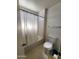 Bathroom featuring a combination bathtub and shower, plus a toilet and vanity with sink at 11216 N 52Nd Ave, Glendale, AZ 85304