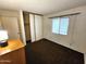Bedroom featuring carpet, a window with blind and sliding door closet at 11216 N 52Nd Ave, Glendale, AZ 85304
