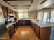 Large kitchen featuring wood cabinets, stainless steel appliances, and lots of counter space at 11216 N 52Nd Ave, Glendale, AZ 85304