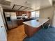 Spacious kitchen featuring stainless steel refrigerator and a large island with breakfast bar at 11216 N 52Nd Ave, Glendale, AZ 85304