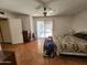Large main bedroom featuring neutral walls, a ceiling fan, and access to the backyard at 11216 N 52Nd Ave, Glendale, AZ 85304