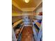 Walk-in pantry with organized shelving for ample storage of food and household goods at 11216 N 52Nd Ave, Glendale, AZ 85304