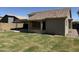 Backyard featuring a covered patio and well-maintained lawn at 12586 W Amelia Ave, Avondale, AZ 85392