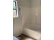 A bright bathroom featuring a shower-tub combination at 12586 W Amelia Ave, Avondale, AZ 85392