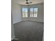 Corner bedroom with carpet and two large windows at 12586 W Amelia Ave, Avondale, AZ 85392