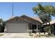 Charming single-story home featuring a two-car garage and well-maintained landscaping at 12586 W Amelia Ave, Avondale, AZ 85392