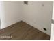 Laundry room with laminate floors, and utility connections at 12586 W Amelia Ave, Avondale, AZ 85392