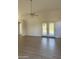 This open living room features new flooring and double doors to the backyard at 12586 W Amelia Ave, Avondale, AZ 85392