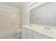 Bathroom features a double sink vanity, large mirror, and a shower-tub combo at 1371 W Gary Dr, Chandler, AZ 85224
