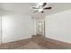 Clean bedroom featuring a ceiling fan and neutral carpet at 1371 W Gary Dr, Chandler, AZ 85224