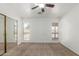 Bedroom with neutral carpet, large mirrored closet, and bright windows at 1371 W Gary Dr, Chandler, AZ 85224