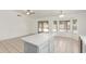 Open dining area with tile flooring, backyard access, and a built-in kitchen island at 1371 W Gary Dr, Chandler, AZ 85224