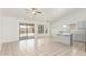 Open-concept kitchen with access to the patio, white cabinets, and center island at 1371 W Gary Dr, Chandler, AZ 85224