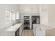 Kitchen featuring an island and modern appliances, perfect for cooking and entertaining at 1371 W Gary Dr, Chandler, AZ 85224