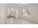 Bright living room features a large window and tile flooring, and offers view to the front door at 1371 W Gary Dr, Chandler, AZ 85224
