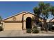 Charming single-story home featuring a well-maintained front yard, neutral stucco, and attached two-car garage at 17293 N Ponca Way, Surprise, AZ 85374