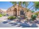 Charming single-story home featuring well-maintained landscaping, a welcoming entrance, and a two-car garage at 17293 N Ponca Way, Surprise, AZ 85374