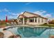 Resort-style backyard oasis with a sparkling pool, spa, and lounge area for outdoor relaxation at 17909 W Agave Rd, Goodyear, AZ 85338