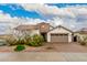 Charming single-story home with a well-manicured front yard and a two-car garage at 17909 W Agave Rd, Goodyear, AZ 85338