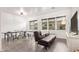 Spacious game room with a ping pong table, foosball table, and a comfortable sofa at 17909 W Agave Rd, Goodyear, AZ 85338