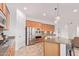 Modern kitchen with stainless steel appliances, granite countertops, and central island at 17909 W Agave Rd, Goodyear, AZ 85338