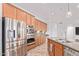 Kitchen with stainless steel appliances, granite countertops, and stylish fixtures at 17909 W Agave Rd, Goodyear, AZ 85338