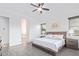 Serene main bedroom features a ceiling fan, natural light, and spacious layout at 17909 W Agave Rd, Goodyear, AZ 85338