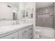 Bathroom with granite countertop, gray tiled shower, and modern features at 18 E Hermosa Dr # 18, Tempe, AZ 85282