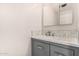 Bathroom vanity features marble countertop and decorative backsplash tiling at 18 E Hermosa Dr # 18, Tempe, AZ 85282