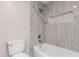 Renovated bathroom features gray tiled shower with built-in shelving at 18 E Hermosa Dr # 18, Tempe, AZ 85282
